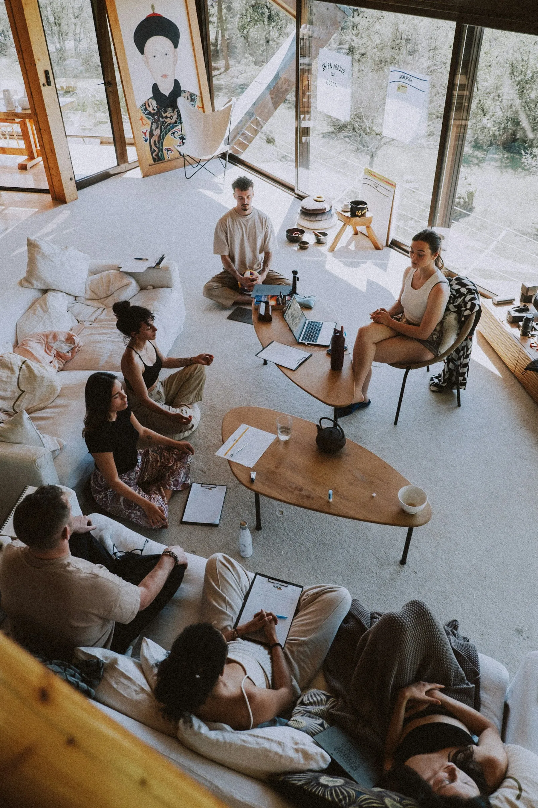 A lived-experience panel session, seated in a circle in a sunlit room